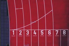 Top-down photo of the numbered lanes on a running track